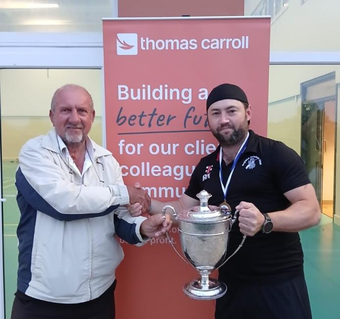 Ross Hardy collects the silverware from Dave Brandon